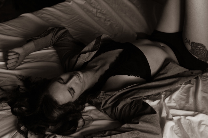 Boudoir Photography, woman in lays in underwear on bed